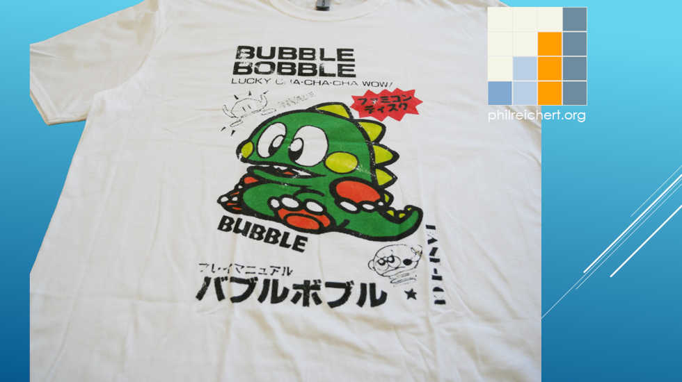 Full Bubble Bobble tee laid flat showing overall graphic placement
