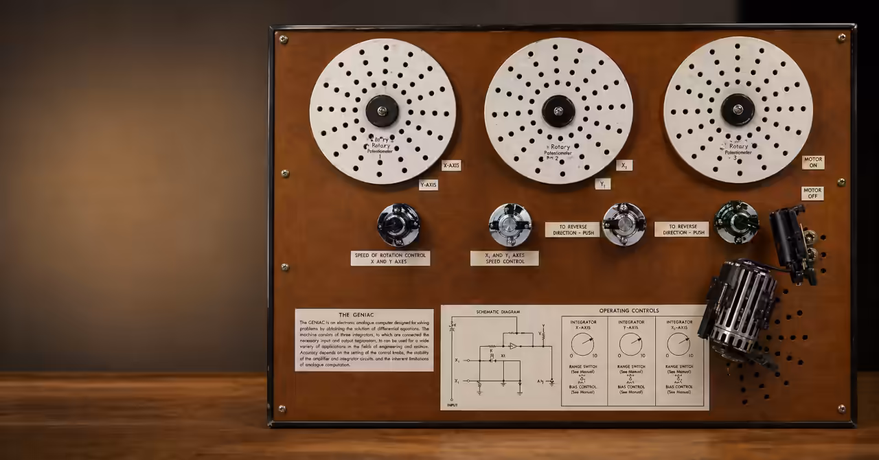 GENIAC analogue computer panel with rotary discs and control switches mounted on a brown board