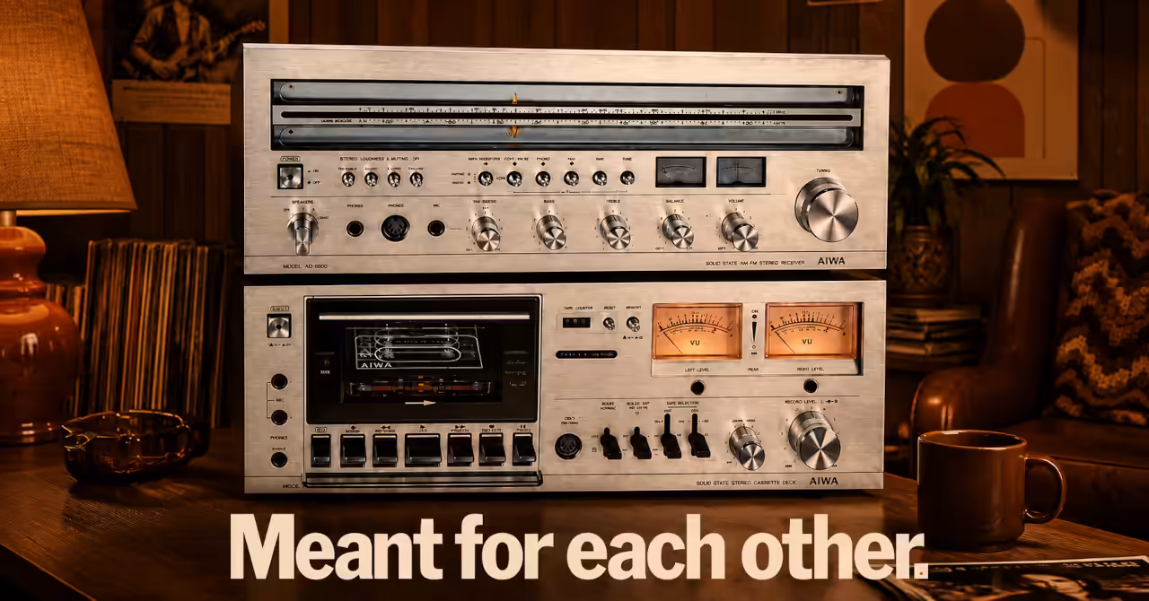 Vintage AIWA AX-7500 receiver and AD-6500 cassette deck displayed in a warm 1977 bachelor apartment, with the original slogan Meant for each other. Artist's impression.